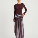 Woman wearing burgundy long sleeve maxi dress with striped skirt detail — BENNI. | Endless UAE