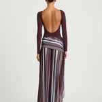 Woman wearing burgundy long sleeve maxi dress with striped skirt detail — BENNI. | Endless UAE