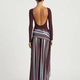 Woman wearing burgundy long sleeve maxi dress with striped skirt detail — BENNI. | Endless UAE