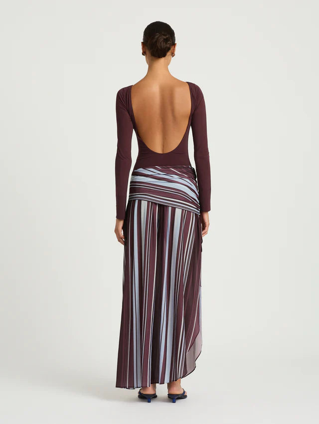 Woman wearing burgundy long sleeve maxi dress with striped skirt detail — BENNI. | Endless UAE
