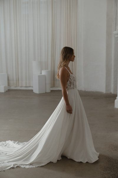 Somerset wedding dress by Madi Lane, ivory A-line gown with beaded bodice and flowing skirt — Madi Lane | Endless UAE
