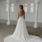Somerset wedding dress by Madi Lane, ivory A-line gown with beaded bodice and flowing skirt — Madi Lane | Endless UAE