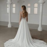 Somerset wedding dress by Madi Lane, ivory A-line gown with beaded bodice and flowing skirt — Madi Lane | Endless UAE
