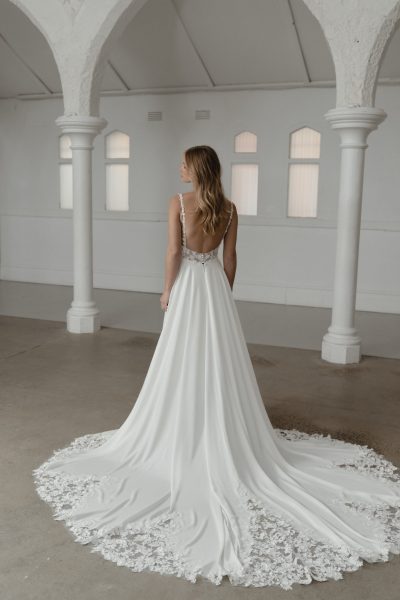 Somerset wedding dress by Madi Lane, ivory A-line gown with beaded bodice and flowing skirt — Madi Lane | Endless UAE