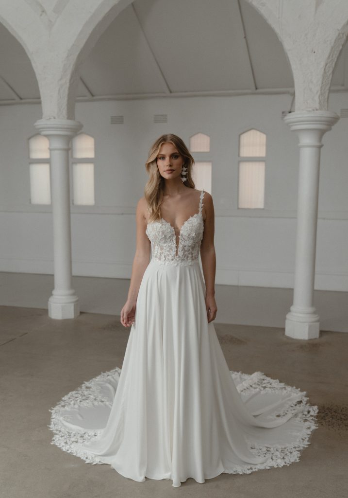 Somerset wedding dress by Madi Lane, ivory A-line gown with beaded bodice and flowing skirt — Madi Lane | Endless UAE
