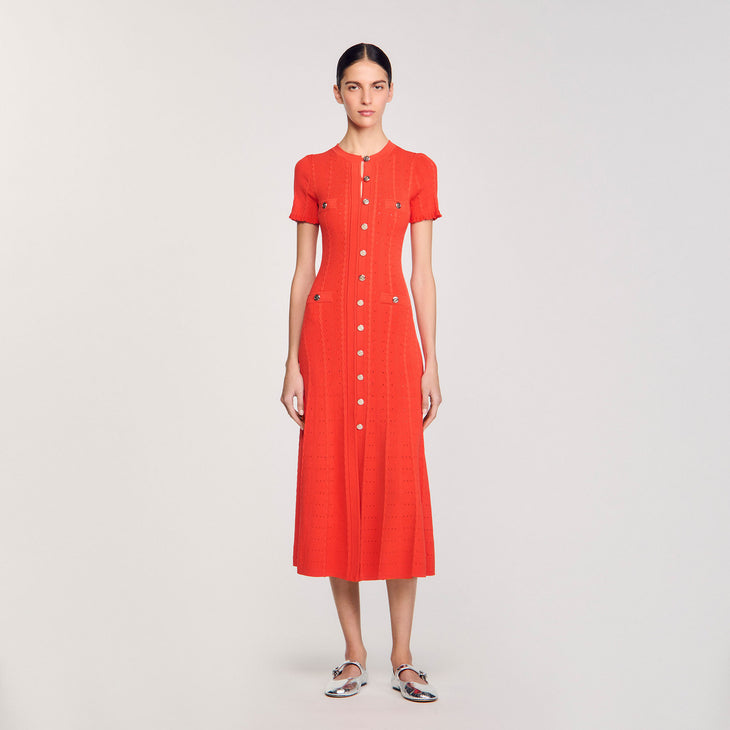 Vibrant coral-red knit maxi dress with decorative button front closure, chest pockets, and short sleeves — Sandro | Endless UAE