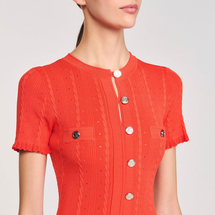 Coral red ribbed knit maxi dress with round buttons and short sleeves on model — Sandro | Endless UAE