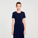Woman wearing navy ribbed knit maxi dress with short sleeves and button front — Endless | Endless UAE