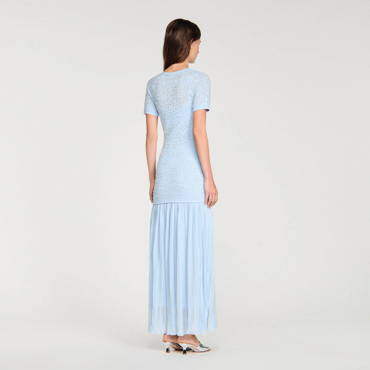 Light blue beaded knit maxi dress with short sleeves and pleated skirt, shown from back view — Sandro | Endless UAE