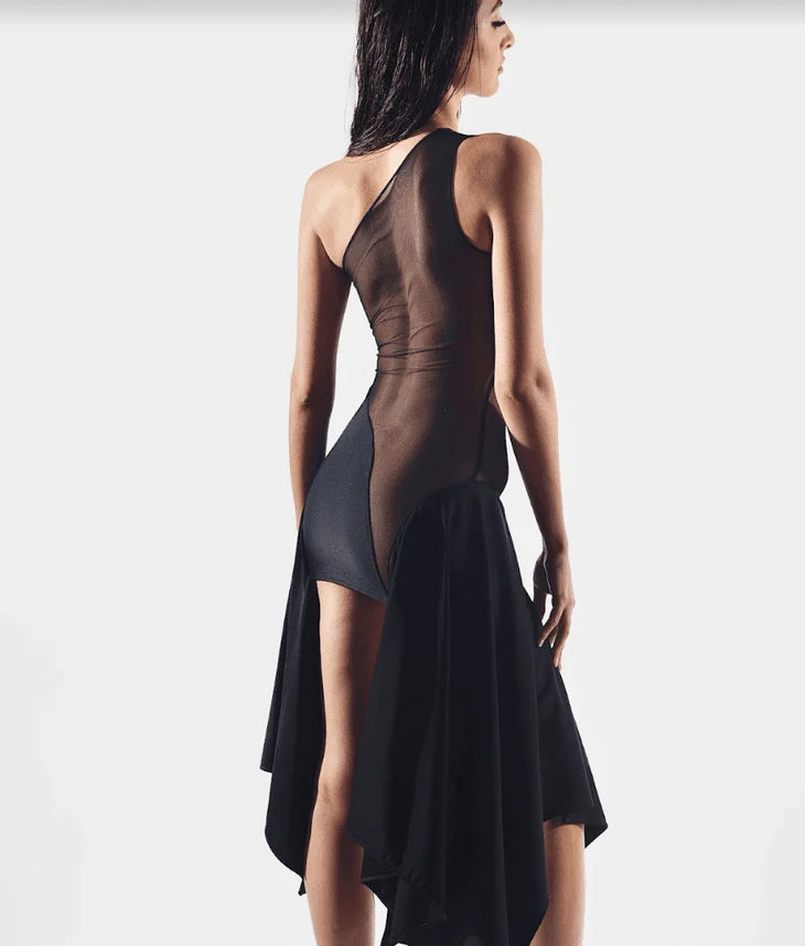 Woman wearing black mesh cut out dress with asymmetrical neckline and draped skirt — Sketch-Y | Endless UAE