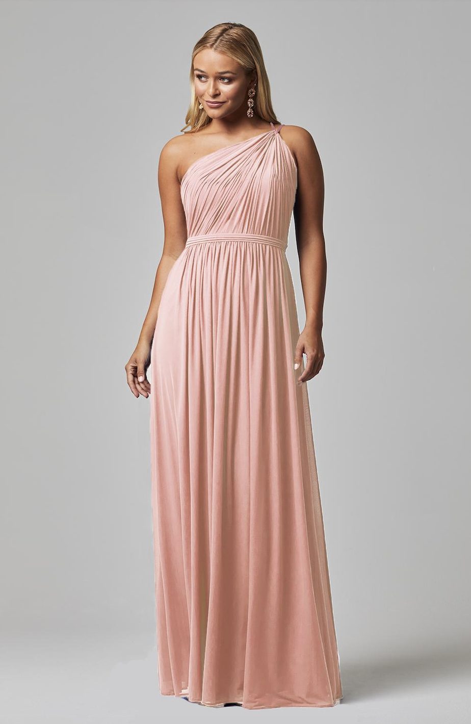 Elegant blush pink one-shoulder bridesmaid dress with pleated bodice and flowing chiffon skirt — You&I Bridal | Endless UAE