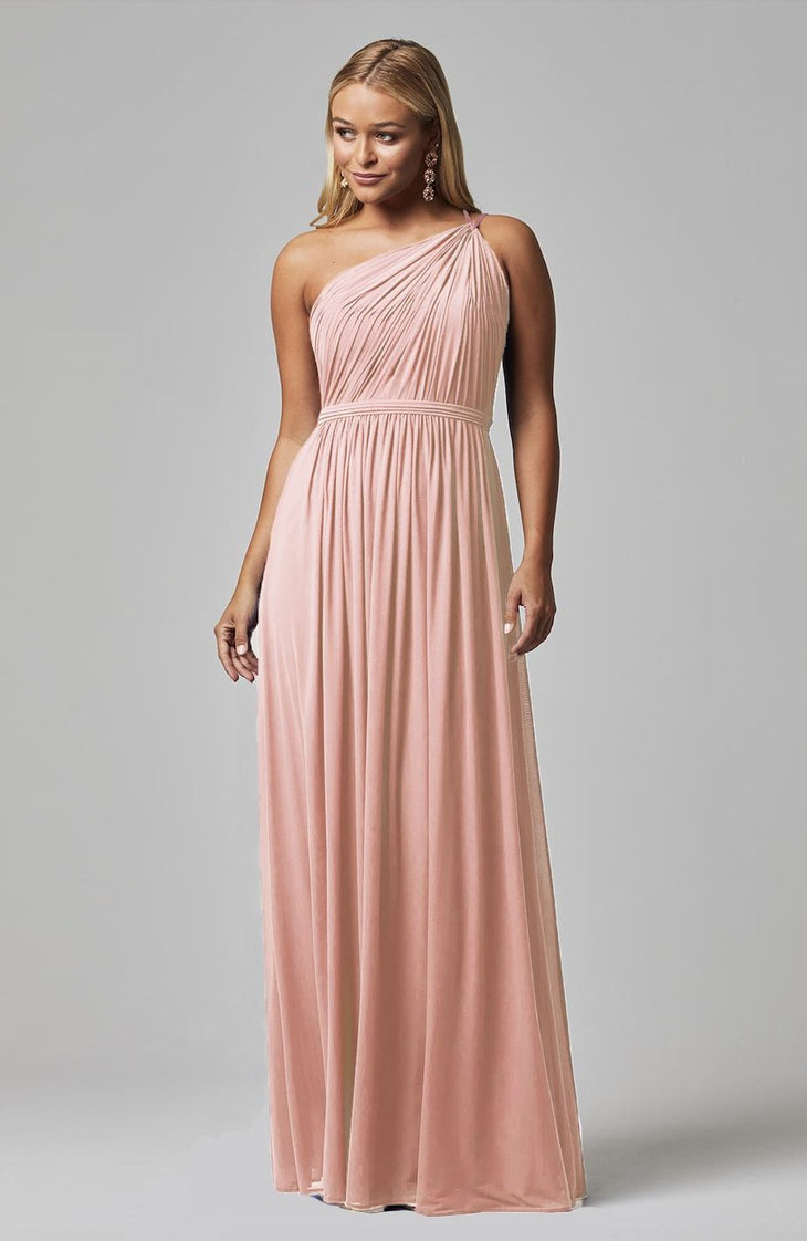 Elegant blush pink one-shoulder bridesmaid dress with pleated bodice and flowing chiffon skirt — You&I Bridal | Endless UAE