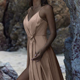 Flowing beige wrap dress with spaghetti straps and tie waist detail, featuring a high slit — You&I Bridal | Endless UAE