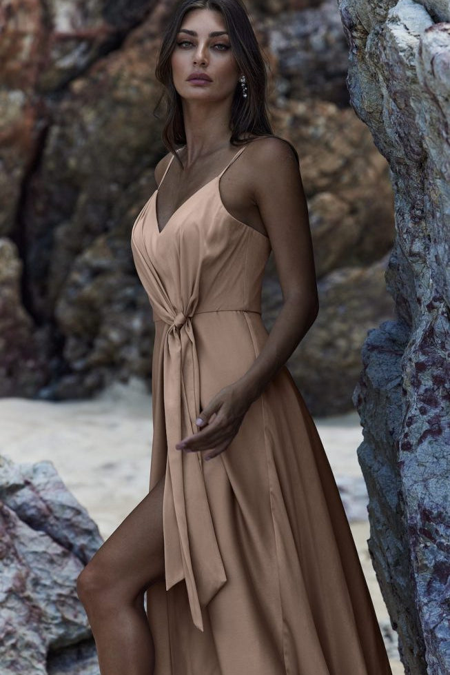 Flowing beige wrap dress with spaghetti straps and tie waist detail, featuring a high slit — You&I Bridal | Endless UAE
