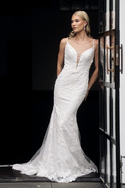Bride in white lace mermaid gown with dramatic train at balcony — JESSICA COUTURE | Endless UAE
