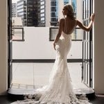 Bride in white lace mermaid gown with dramatic train at balcony — JESSICA COUTURE | Endless UAE