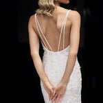 Bride in white lace mermaid gown with dramatic train at balcony — JESSICA COUTURE | Endless UAE