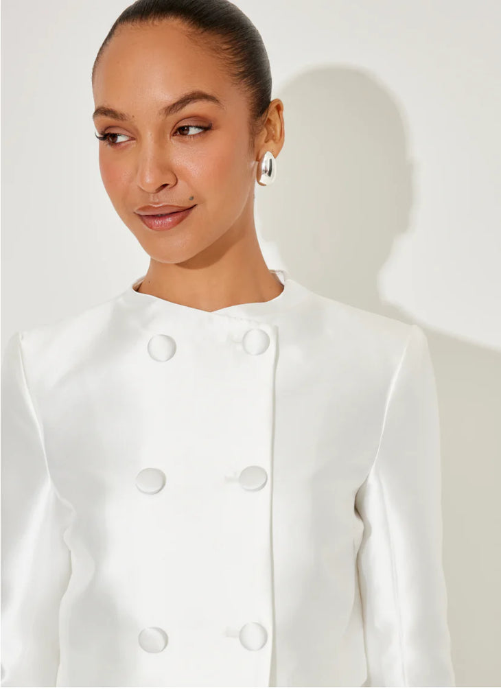 Woman wearing white satin double-breasted blazer with structured shoulders and covered buttons — Odd Muse | Endless UAE