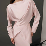 Elegant pale pink co-ord set with draped long-sleeve top and matching skirt on model — Nora The Label | Endless UAE