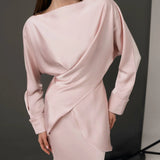 Elegant pale pink co-ord set with draped long-sleeve top and matching skirt on model — Nora The Label | Endless UAE