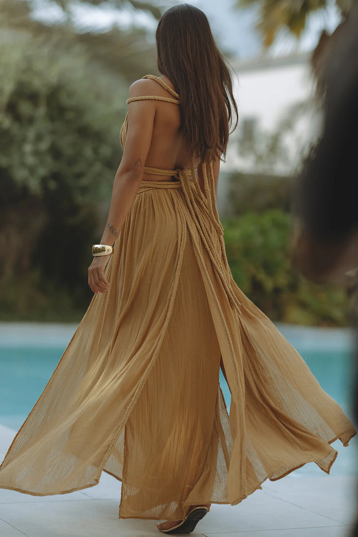 Flowing golden silk maxi dress with rope details and open back design by poolside — Chic Le Frique | Endless UAE