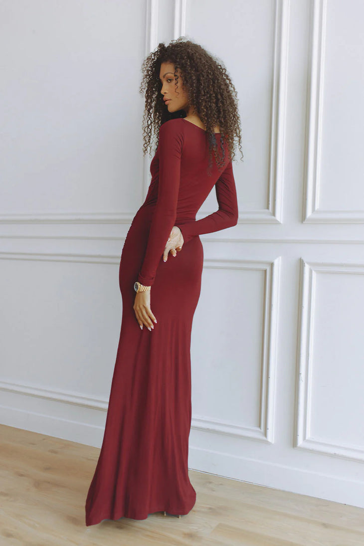 Elegant burgundy long-sleeve maxi dress with fitted silhouette, shown from back view — Chic Le Frique | Endless UAE