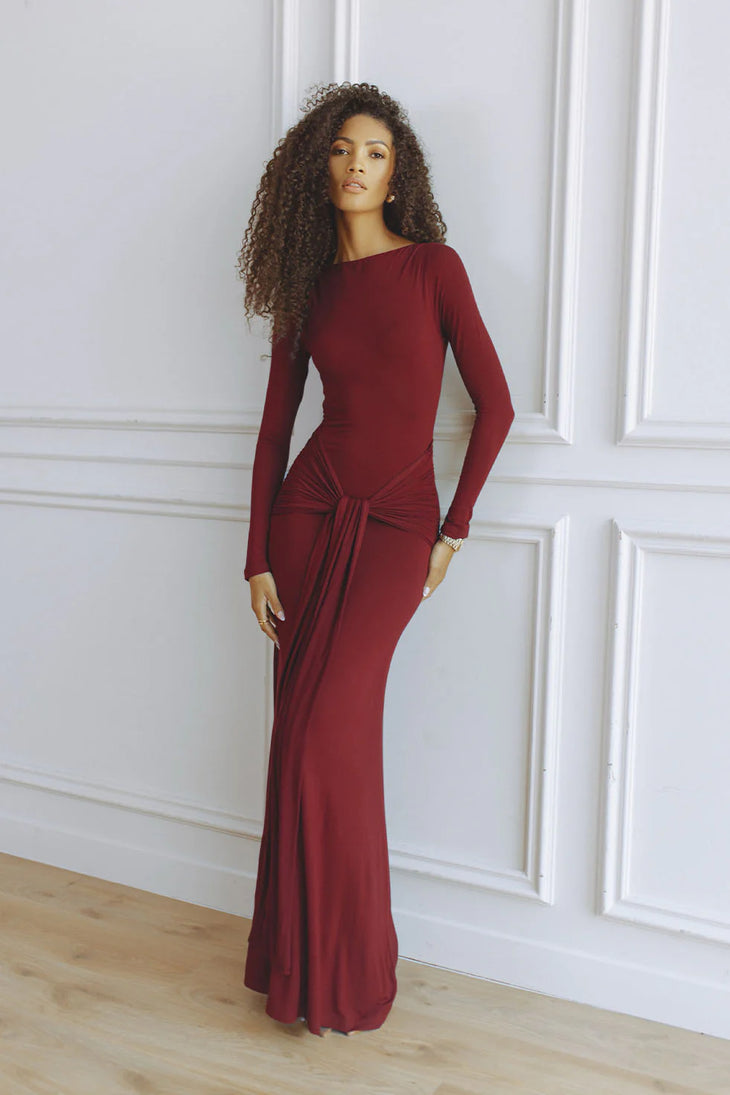 Elegant burgundy long-sleeve maxi dress with gathered waist detail on model — Chic Le Frique | Endless UAE