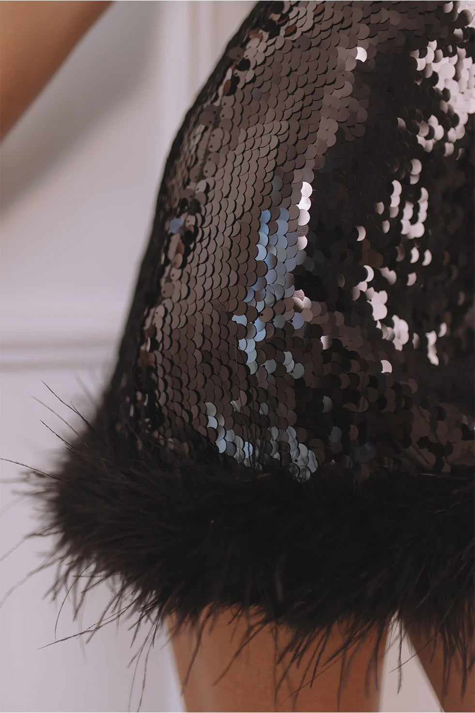 Black sequin halter mini dress with faux fur hem detail — Chic Le Frique | Endless UAE