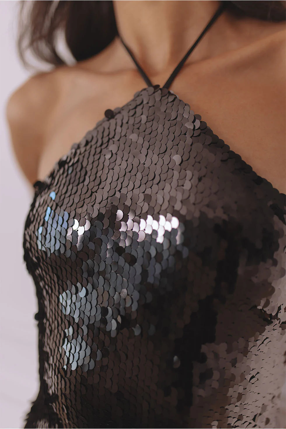 Black sequin halter mini dress with faux fur hem detail — Chic Le Frique | Endless UAE