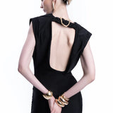 Woman wearing black sleeveless maxi dress with ruched side detail and gold bangles — Lediel | Endless UAE