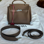 Brown leather structured handbag with gold hardware and pink shoulder strap — Endless | Endless UAE