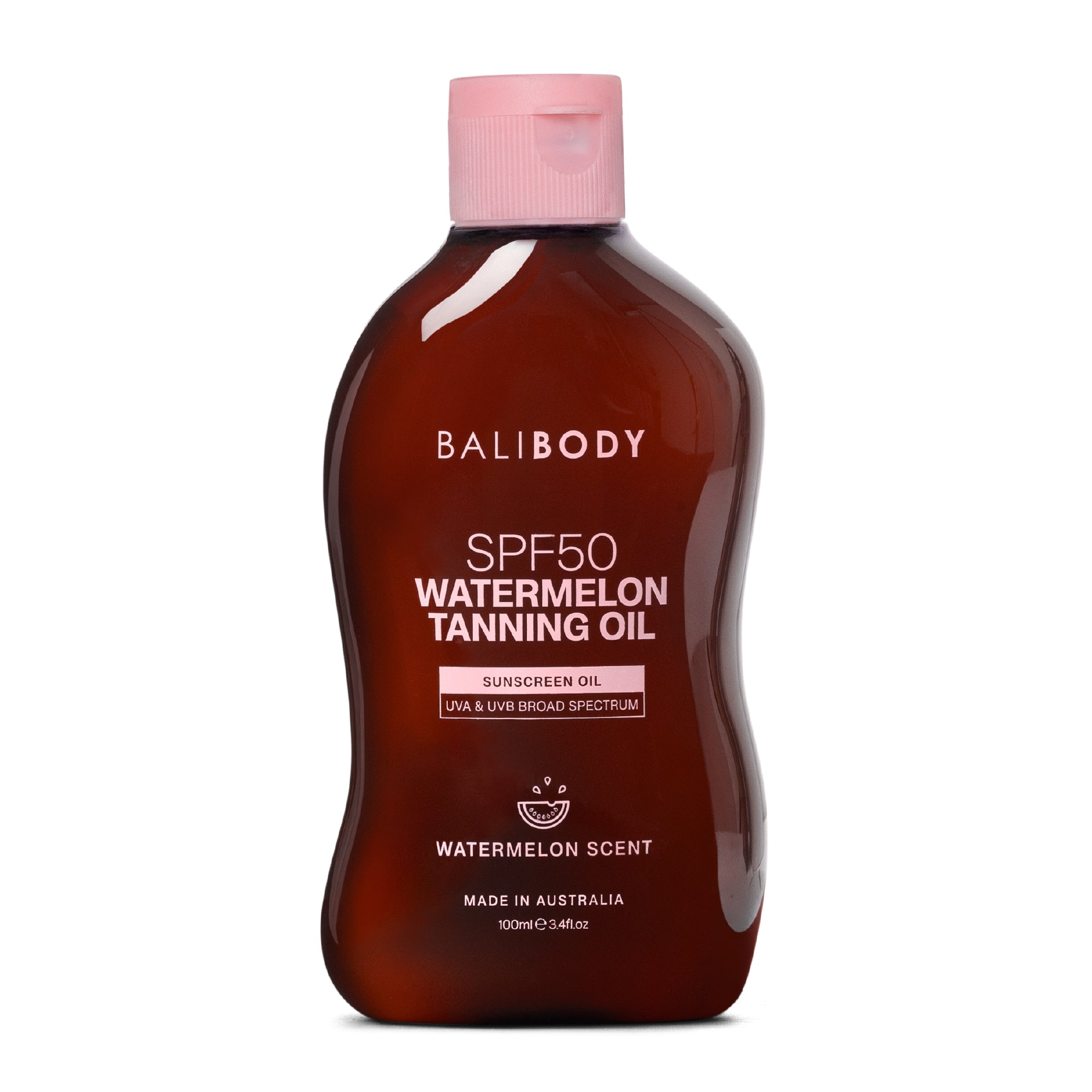 SPF50 Watermelon Tanning Oil sunscreen in amber bottle with pink cap — Bali Body | Endless UAE