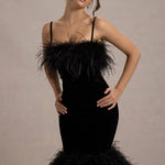 Woman wearing black velvet midi dress with feather trim and spaghetti straps — Club L London | Endless UAE