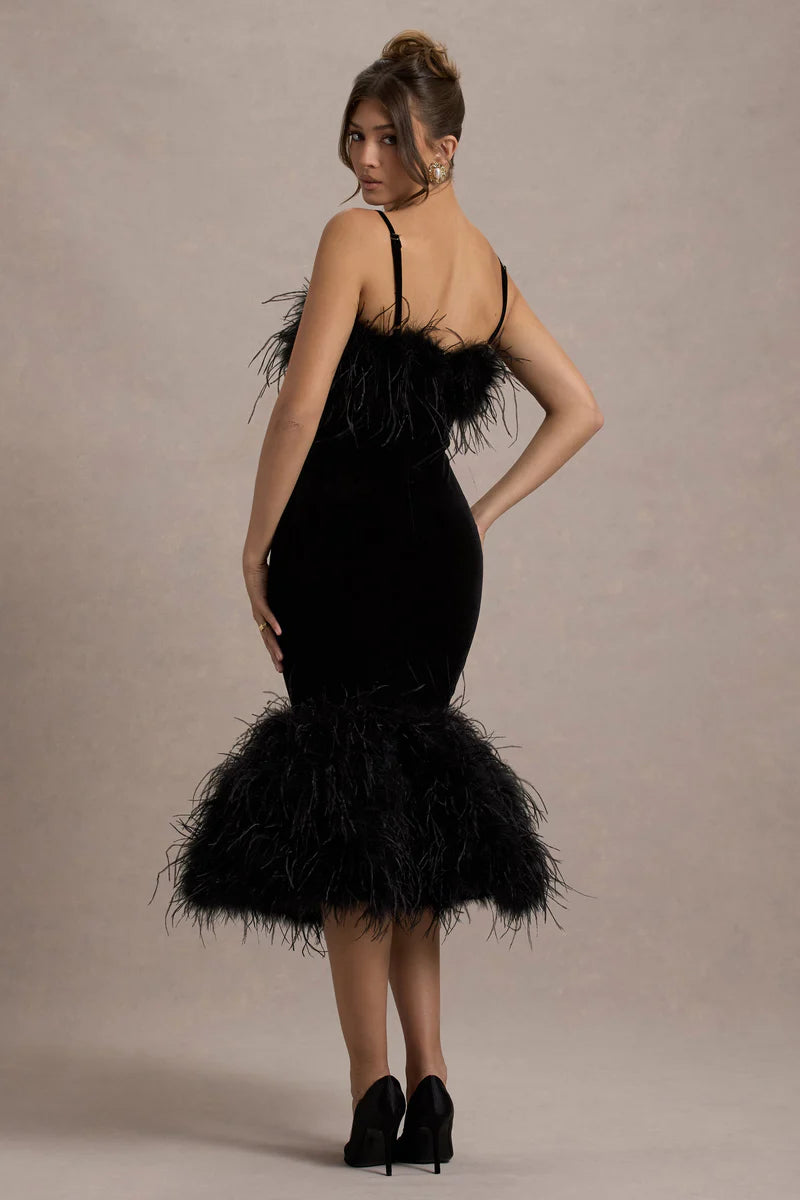 Woman wearing black velvet midi dress with feather trim and spaghetti straps — Club L London | Endless UAE