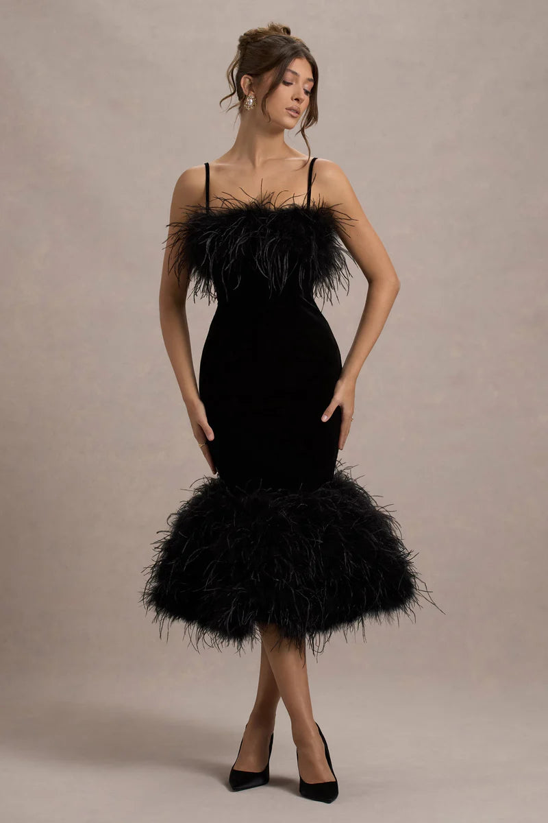 Woman wearing black velvet midi dress with feather trim and spaghetti straps — Club L London | Endless UAE
