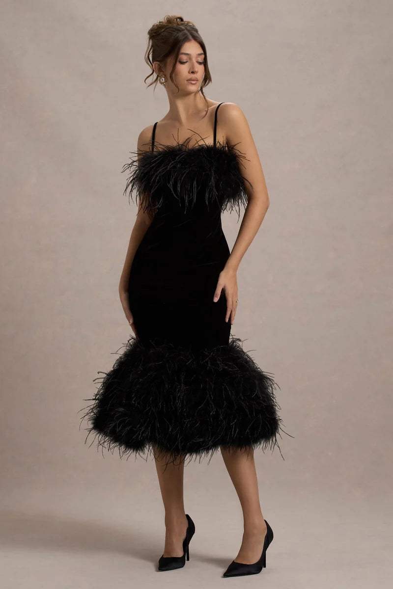 Woman wearing black velvet midi dress with feather trim and spaghetti straps — Club L London | Endless UAE