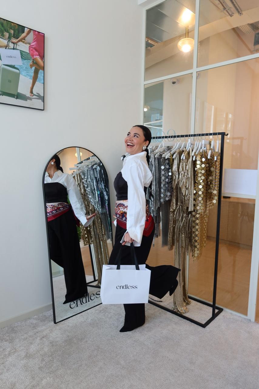 Woman styling event wear with sequined dresses and chain accessories — Endless | Endless UAE