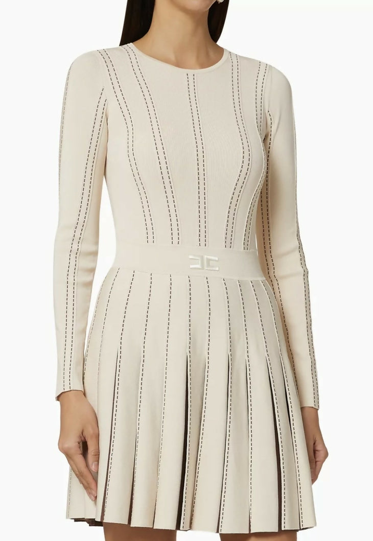 Cream knit dress with dark contrasting stitching, long sleeves, pleated skirt and fitted bodice — Elisabetta Franchi | Endless UAE