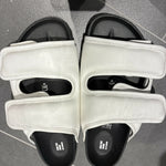 White leather CSM Cosy sandals with black footbed and dual strap design viewed from above — 1774 Birkenstock | Endless UAE