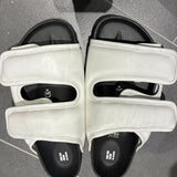 White leather CSM Cosy sandals with black footbed and dual strap design viewed from above — 1774 Birkenstock | Endless UAE
