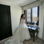 Elegant bride in a white lace ball gown wedding dress with V-neckline and cathedral train in luxurious suite — Rosa Clara | Endless UAE