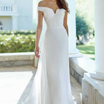 Off-shoulder white wedding dress with ruched bodice and flowing skirt — Justin Alexander | Endless UAE