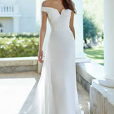 Off-shoulder white wedding dress with ruched bodice and flowing skirt — Justin Alexander | Endless UAE
