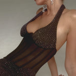 Blonde woman wearing black sparkle embellished corset with sheer mesh panel and crystal drop earrings — Endless | Endless UAE