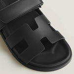 Black leather Chypre sandal with iconic H-cut design and adjustable ankle strap — Hermes | Endless UAE