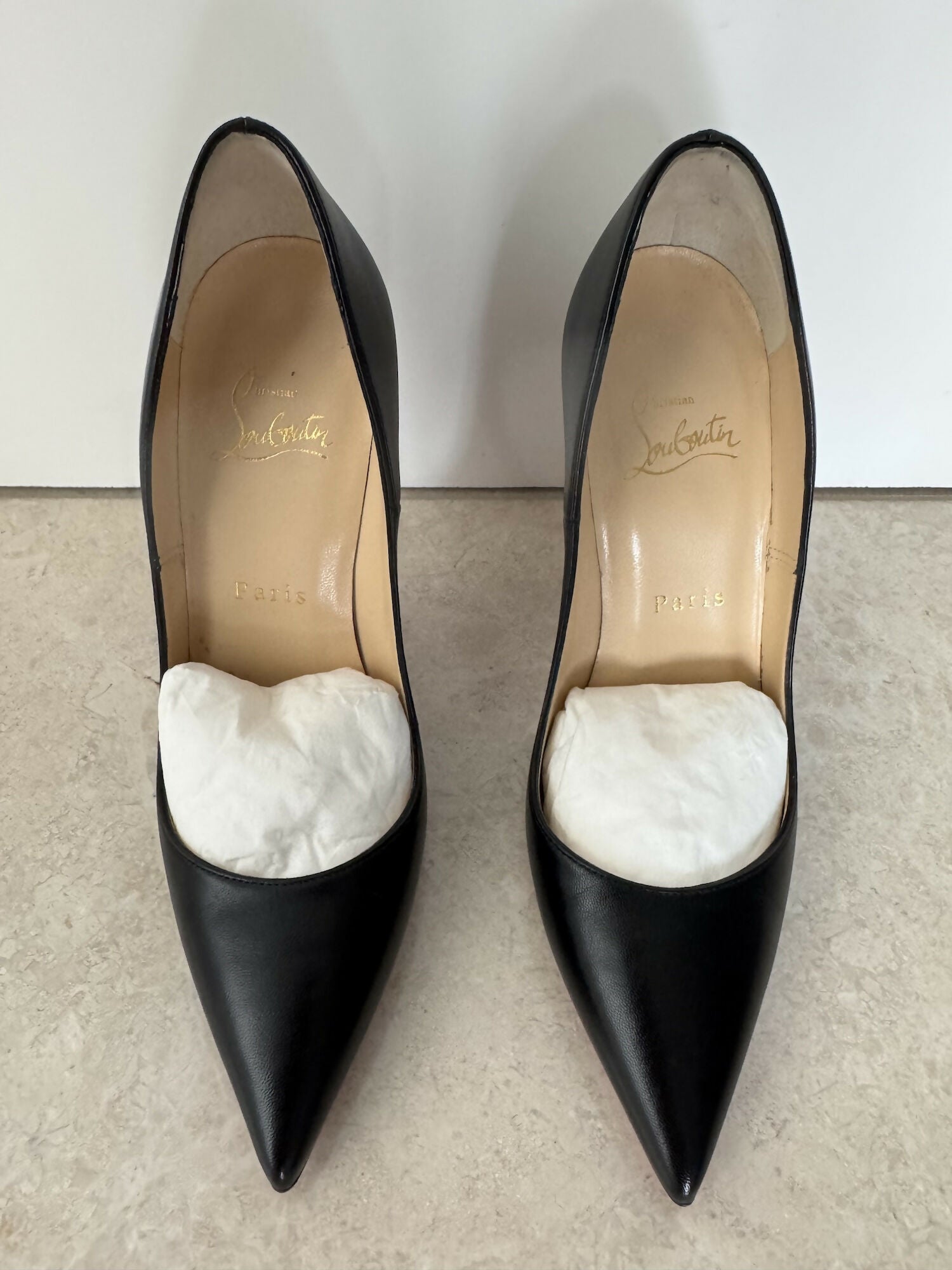 Black pointed-toe pumps with beige leather insole and white tissue paper insert — Endless | Endless UAE