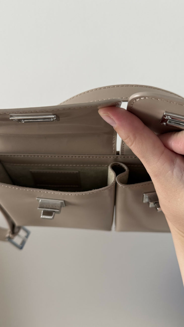 Beige patent leather shoulder bag with dual compartments and silver turnlock closures — Endless | Endless UAE