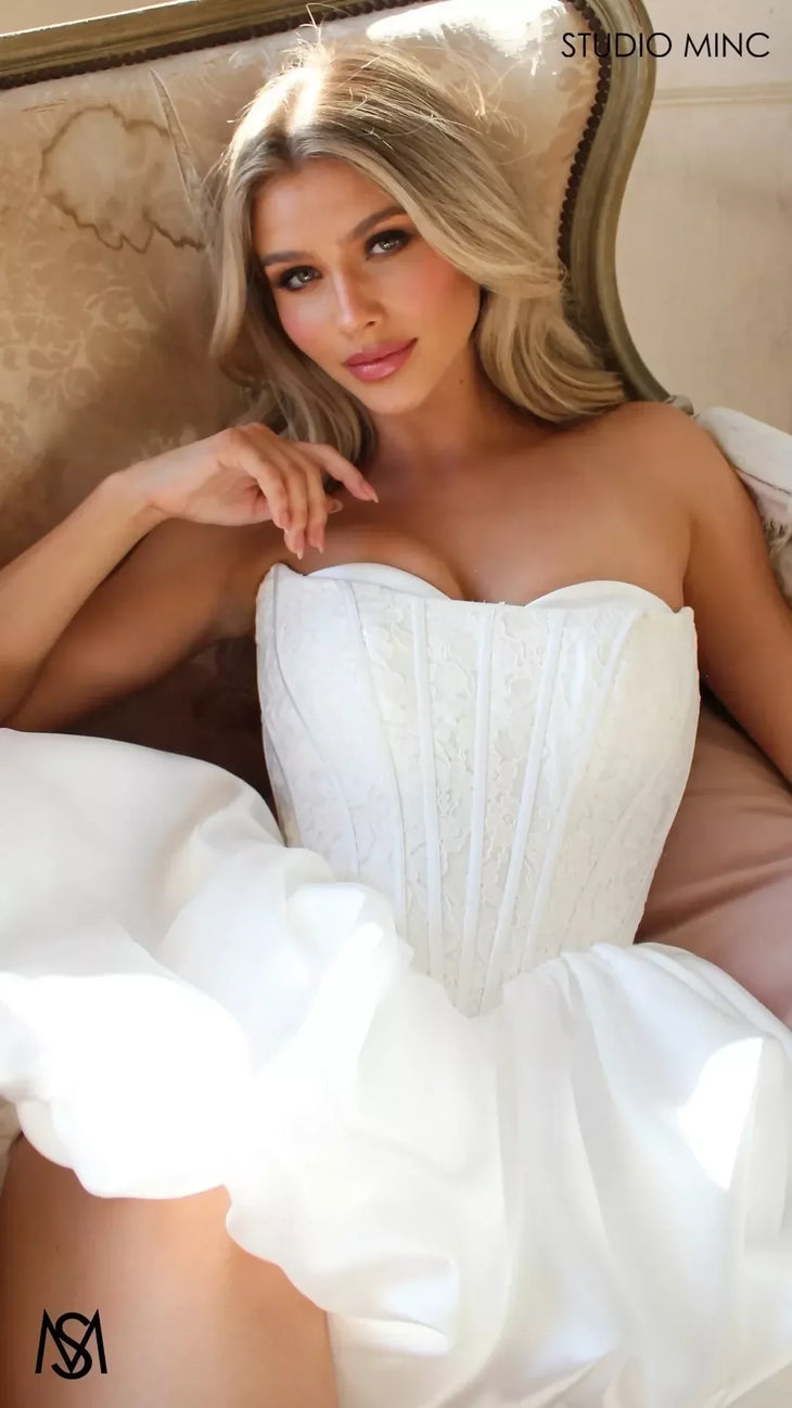 Woman wearing white strapless sweetheart neckline bubble hem mini dress — Studio Minc Australia | Endless UAE