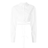 White cropped silk shirt with long sleeves and wrap-around tie detail at waist — Christopher Esber | Endless UAE