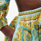 Vibrant paisley printed midi dress with tie-front detail and puff sleeves in turquoise and gold tones — Zimmermann | Endless UAE
